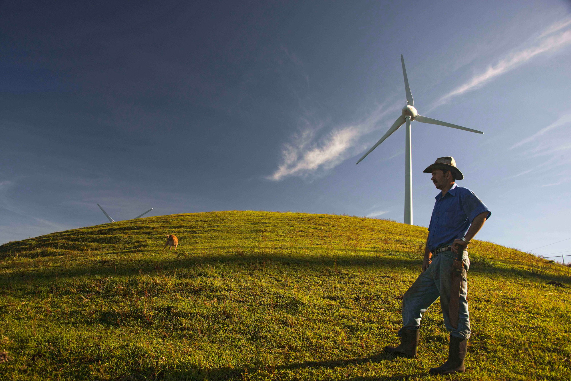 Wind turbines in a scenic Costa Rican landscape, symbolizing the growth potential for wind energy in the country.