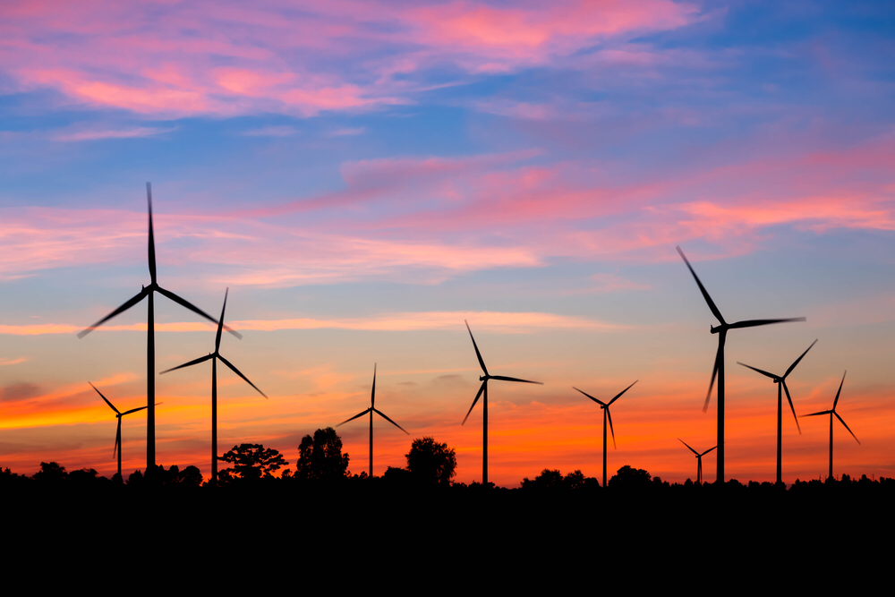 Wind turbines in Costa Rica during a beautiful sunset, symbolizing the bright future of wind energy in the country.